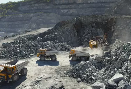 Excavator,And,Heavy,Mining,Dump,Trucks,In,A,Limestone,Quarry,