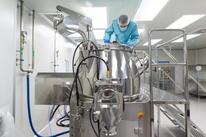 scientist look in steel tank in laboratory scientist look in steel tank in laboratory